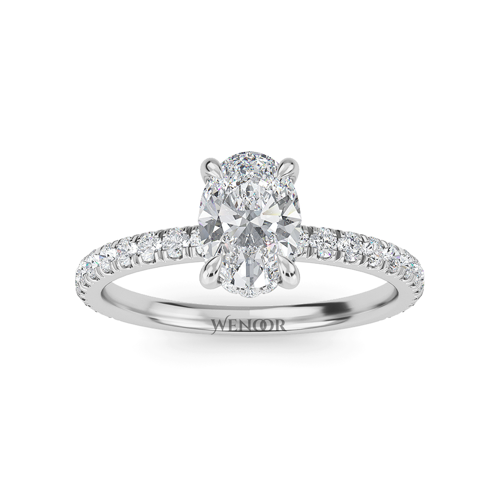 Elegant oval cut lab diamond engagement ring with a hidden halo setting, featuring sparkling accent stones.