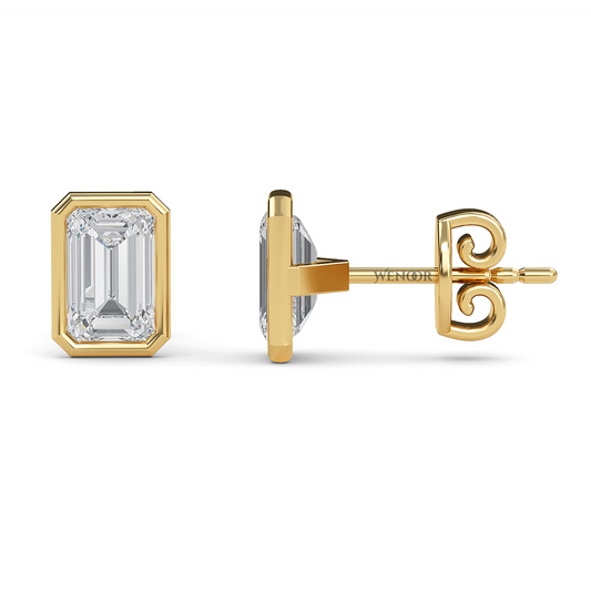Woman wearing emerald cut bezel stud lab diamond earrings – sustainable fine jewelry