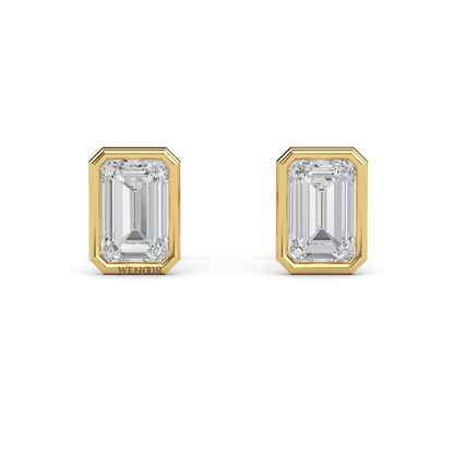 Woman wearing emerald cut bezel stud lab diamond earrings – sustainable fine jewelry