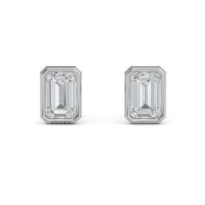 Woman wearing emerald cut bezel stud lab diamond earrings – sustainable fine jewelry