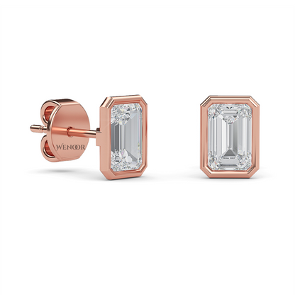 Woman wearing emerald cut bezel stud lab diamond earrings – sustainable fine jewelry