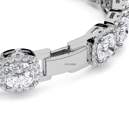 White gold tennis bracelet featuring cushion  and round lab diamonds - luxurious bridal gift.