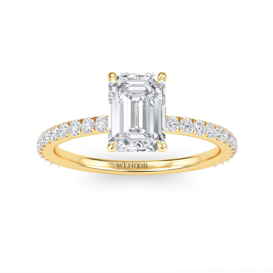 Bride's hand wearing emerald cut lab diamond engagement ring