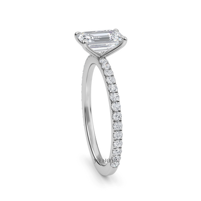 Bride's hand wearing emerald cut lab diamond engagement ring