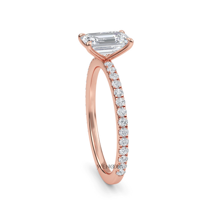 Bride's hand wearing emerald cut lab diamond engagement ring
