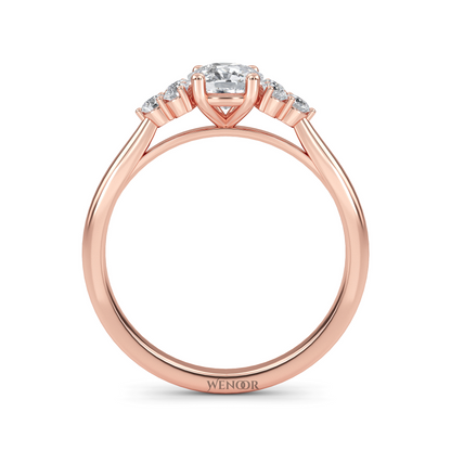 At wenoor Woman wearing cushion cut lab-grown diamond ring on hand, sunlight highlighting its fire and scintillation.