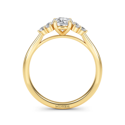 At wenoor Woman wearing cushion cut lab-grown diamond ring on hand, sunlight highlighting its fire and scintillation.
