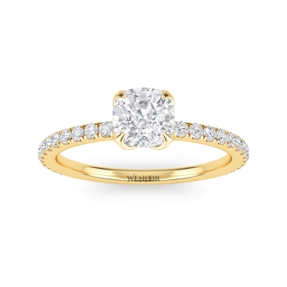 Bride showing cushion cut lab diamond wedding ring on hand