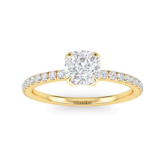 Bride showing cushion cut lab diamond wedding ring on hand