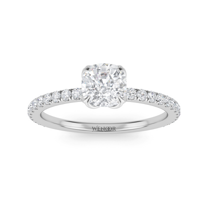 Bride showing cushion cut lab diamond wedding ring on hand