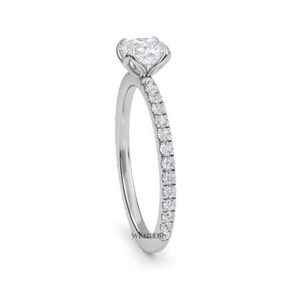 Bride showing cushion cut lab diamond wedding ring on hand