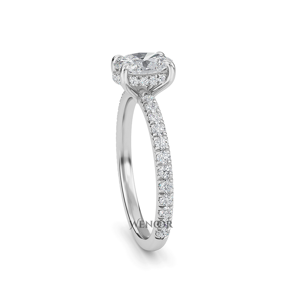 Elegant oval cut lab diamond engagement ring with a hidden halo setting, featuring sparkling accent stones.