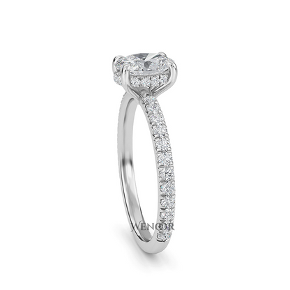 Elegant oval cut lab diamond engagement ring with a hidden halo setting, featuring sparkling accent stones.
