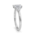 Handmade emerald cut diamond ring worn on hand in yellow gold with IGI certified diamond.