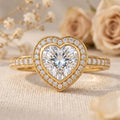 Heart cut lab grown diamond hidden halo engagement ring in yellow gold.