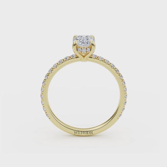 Elegant oval cut lab diamond engagement ring with a hidden halo setting, featuring sparkling accent stones.