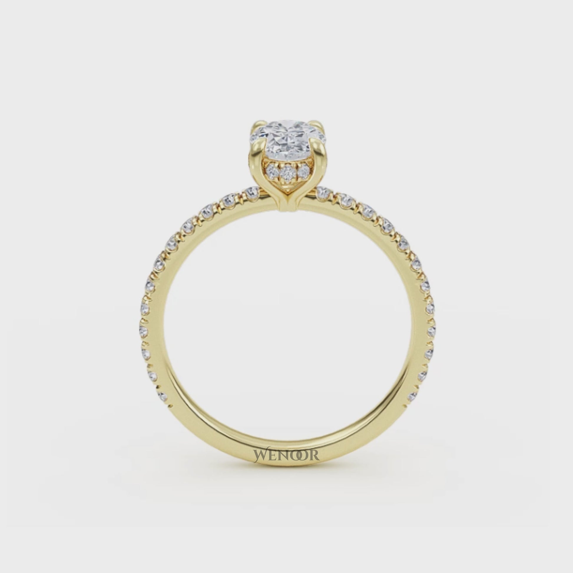 Elegant oval cut lab diamond engagement ring with a hidden halo setting, featuring sparkling accent stones.