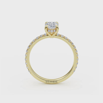 Elegant oval cut lab diamond engagement ring with a hidden halo setting, featuring sparkling accent stones.