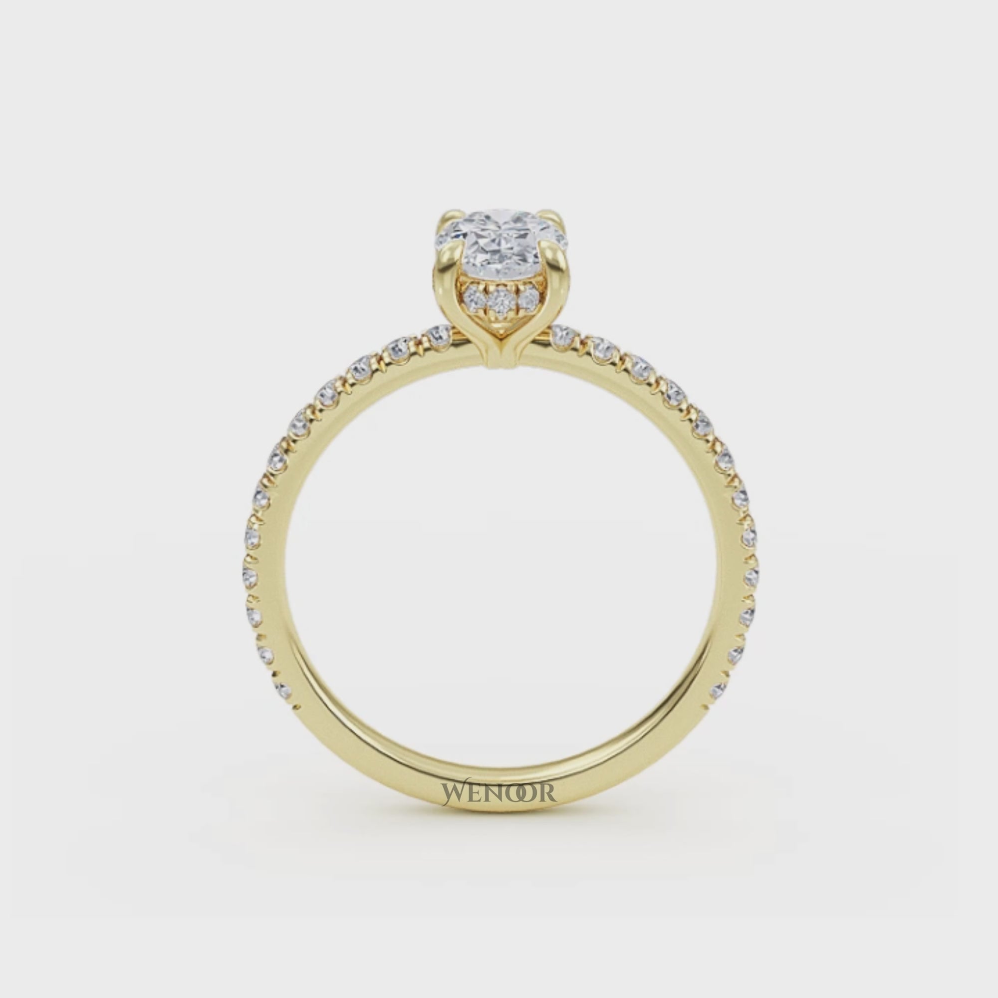 Elegant oval cut lab diamond engagement ring with a hidden halo setting, featuring sparkling accent stones.