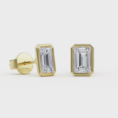 Woman wearing emerald cut bezel stud lab diamond earrings – sustainable fine jewelry