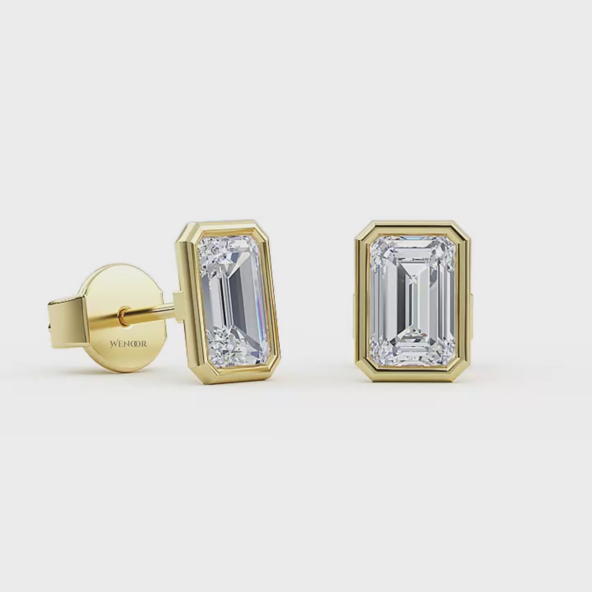 Woman wearing emerald cut bezel stud lab diamond earrings – sustainable fine jewelry