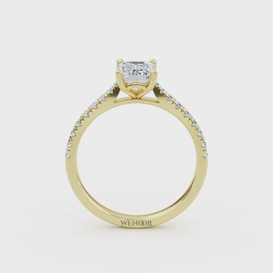 Amerald cut lab grown diamond ring with a gold band and accent side stones, featuring a brilliant step cut center stone