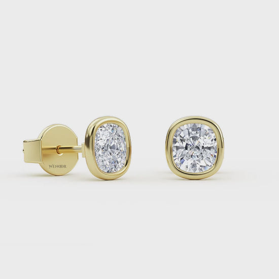 Exquisite cushion cut lab grown diamond stud earrings set in a secure 14K gold bezel setting