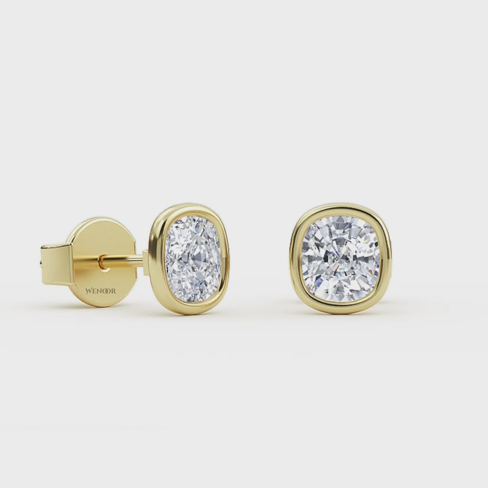 Exquisite cushion cut lab grown diamond stud earrings set in a secure 14K gold bezel setting