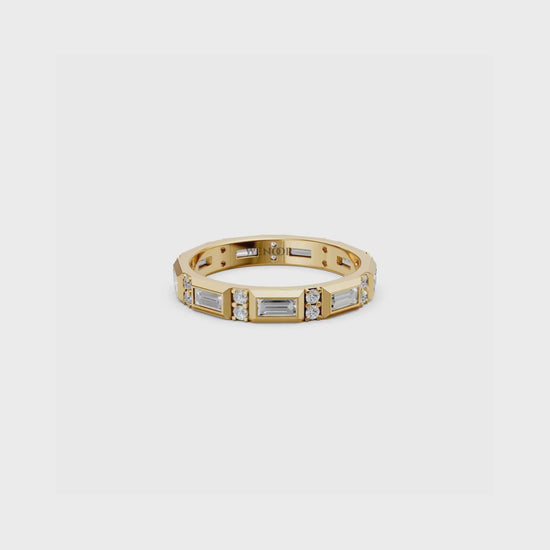 Luxurious bezel set eternity band featuring sparkling round diamonds and geometric baguette cut lab diamonds in rich 14K gold