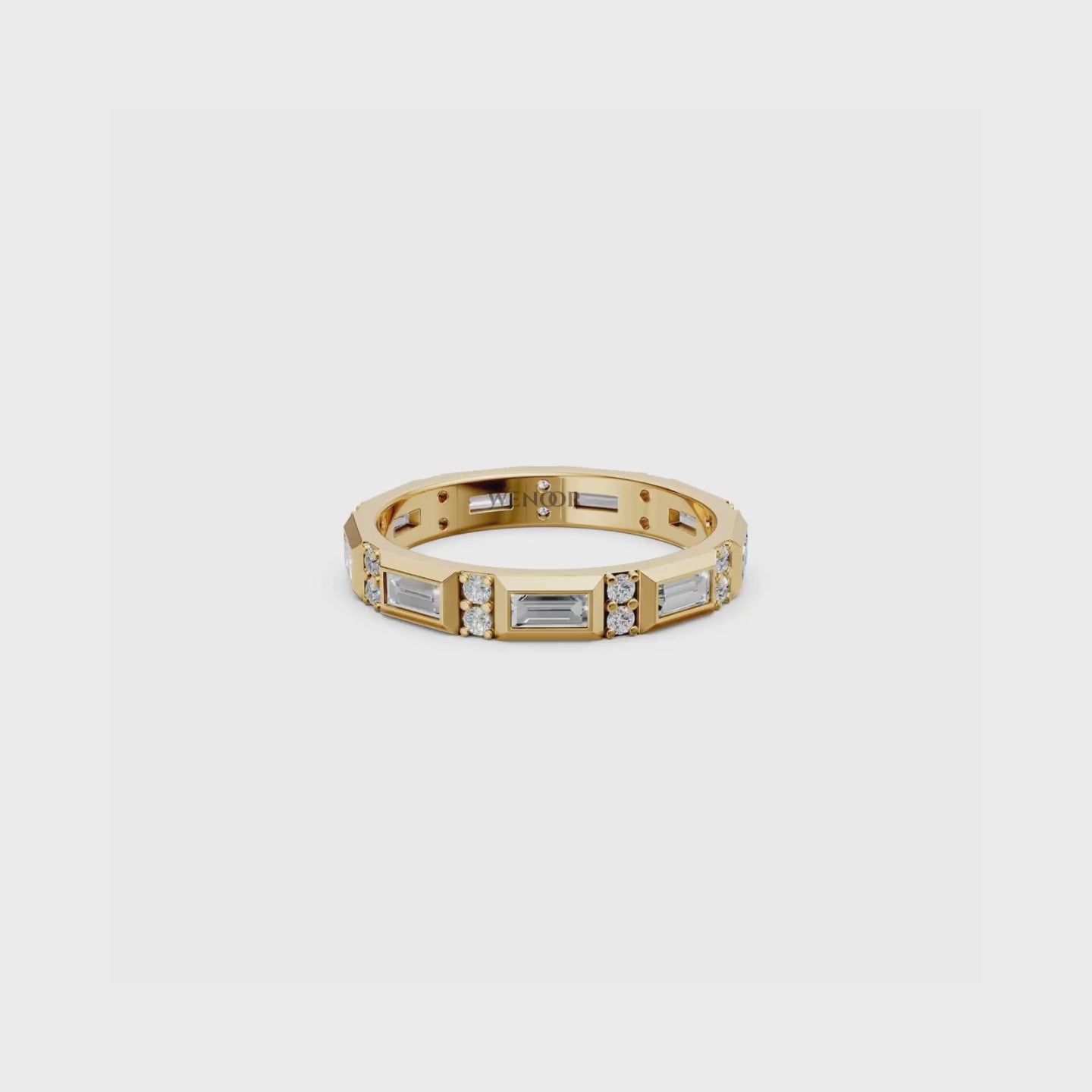 Luxurious bezel set eternity band featuring sparkling round diamonds and geometric baguette cut lab diamonds in rich 14K gold