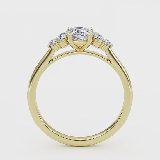 At wenoor Woman wearing cushion cut lab-grown diamond ring on hand, sunlight highlighting its fire and scintillation.