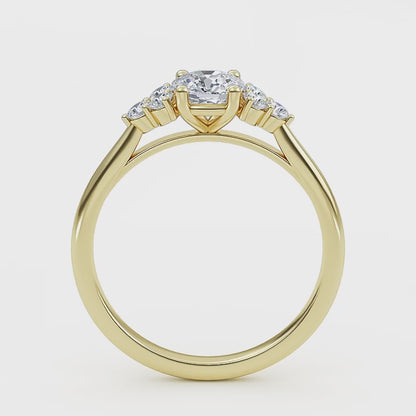 At wenoor Woman wearing cushion cut lab-grown diamond ring on hand, sunlight highlighting its fire and scintillation.
