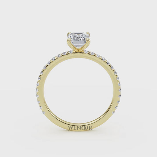 Bride's hand wearing emerald cut lab diamond engagement ring