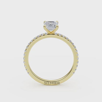 Bride's hand wearing emerald cut lab diamond engagement ring