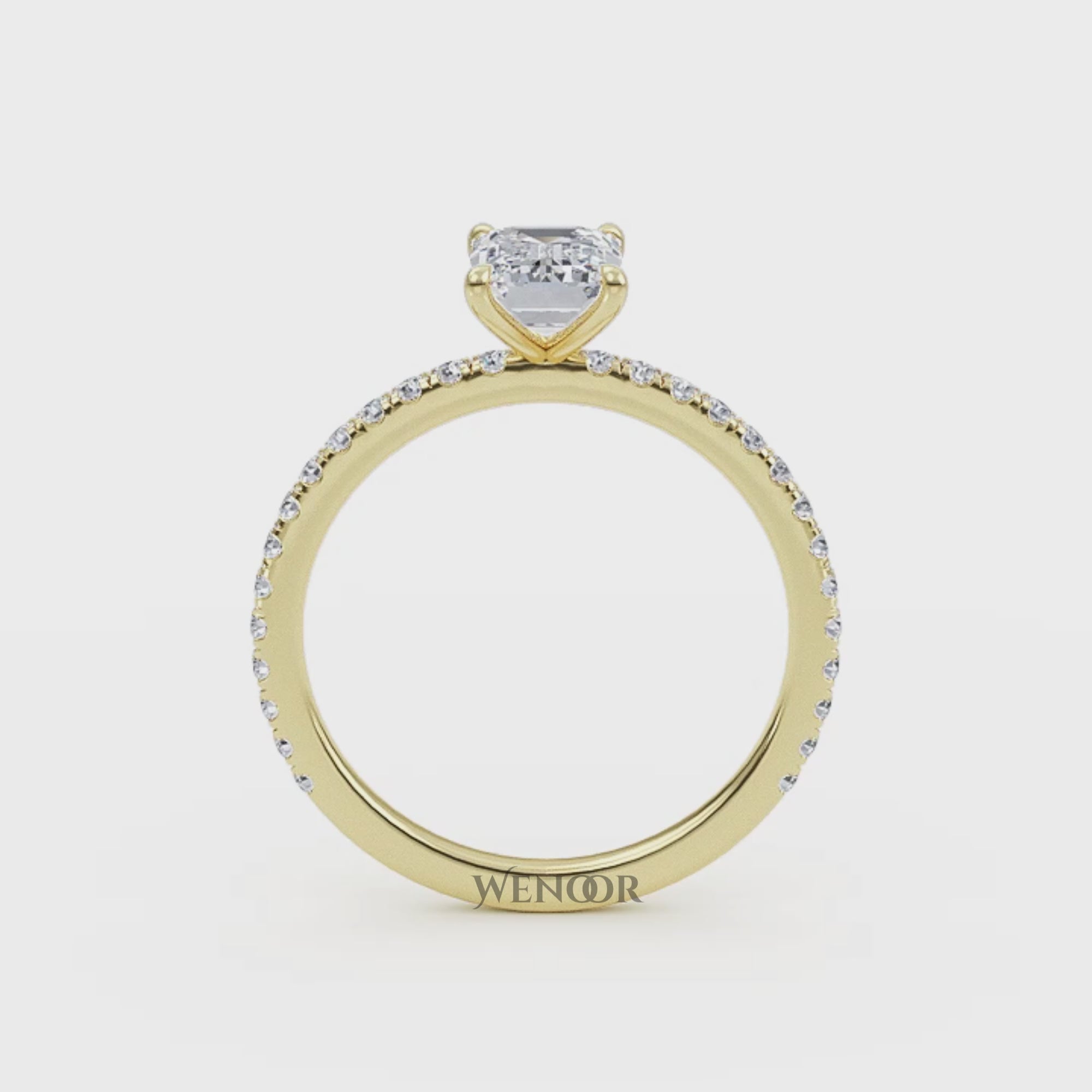 Bride's hand wearing emerald cut lab diamond engagement ring