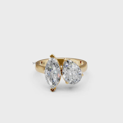 Symbolic Toi et Moi engagement ring with marquise and pear lab diamonds